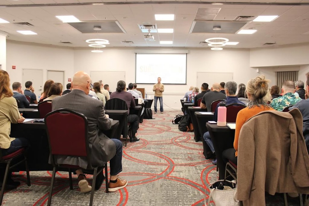 Looking down the aisle as the C3 room listens and takes notes